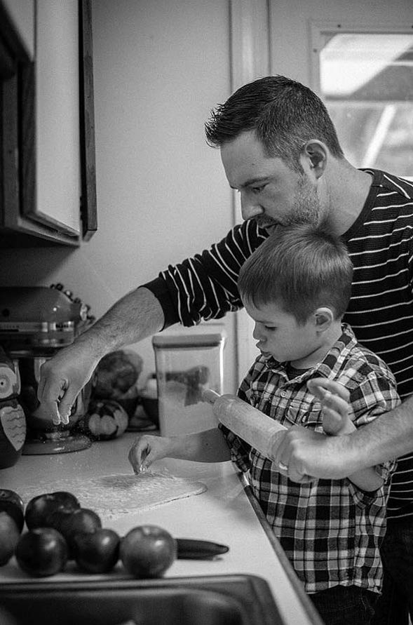 Image of father cooking with his son. Winner of the 2018 Annals Personae prize.
